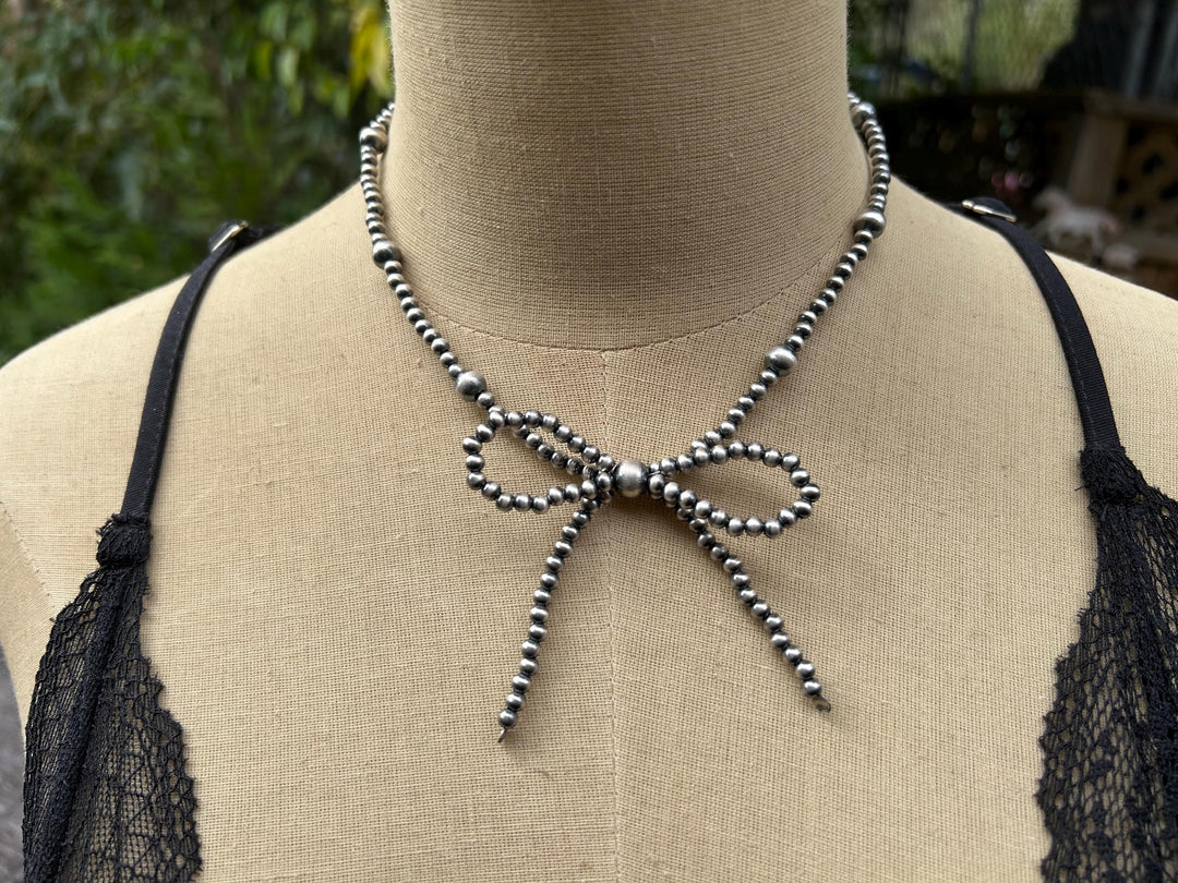 Sterling Silver Bow Necklace: Sterling Silver, Handmade