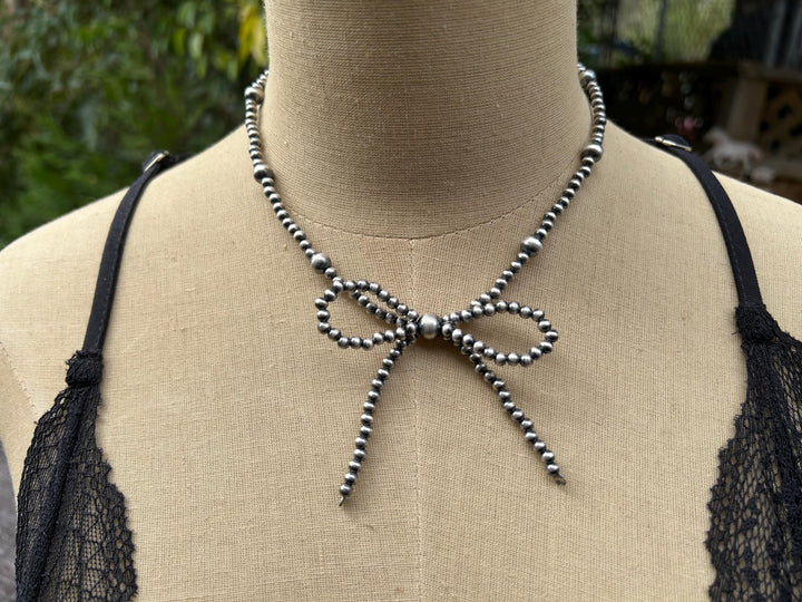 Sterling Silver Bow Necklace: Sterling Silver, Handmade